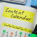 Notebook with content calendar written.